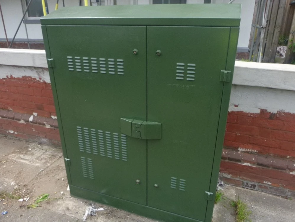 Green box showcasing after graffiti removal has taken place